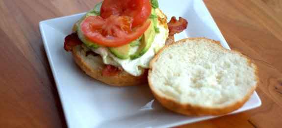 Egg sandwich with tomato, avocado and bacon.