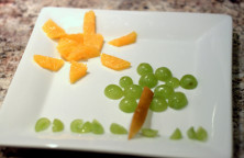 Food art - green grapes, pears and oranges.